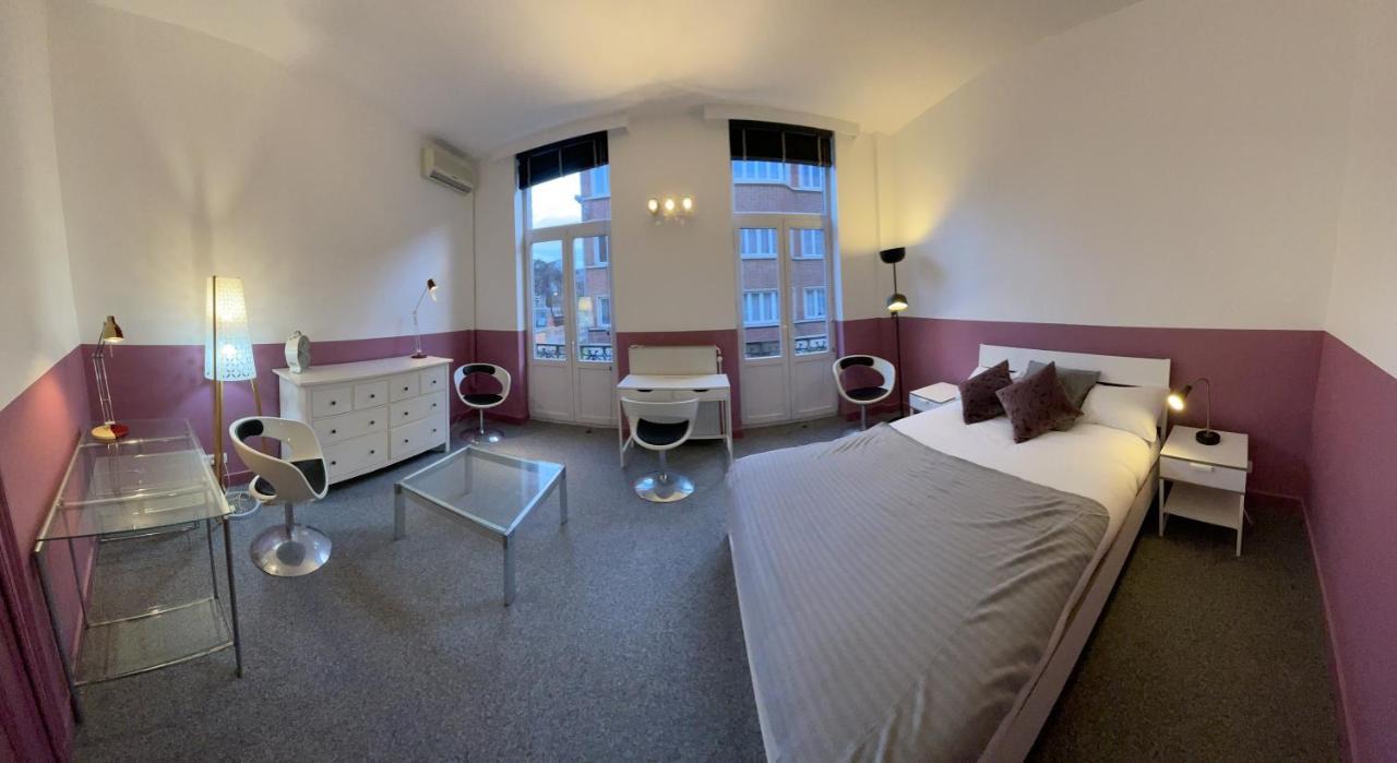 Le Village D'Ezra Anderlecht Bagian luar foto